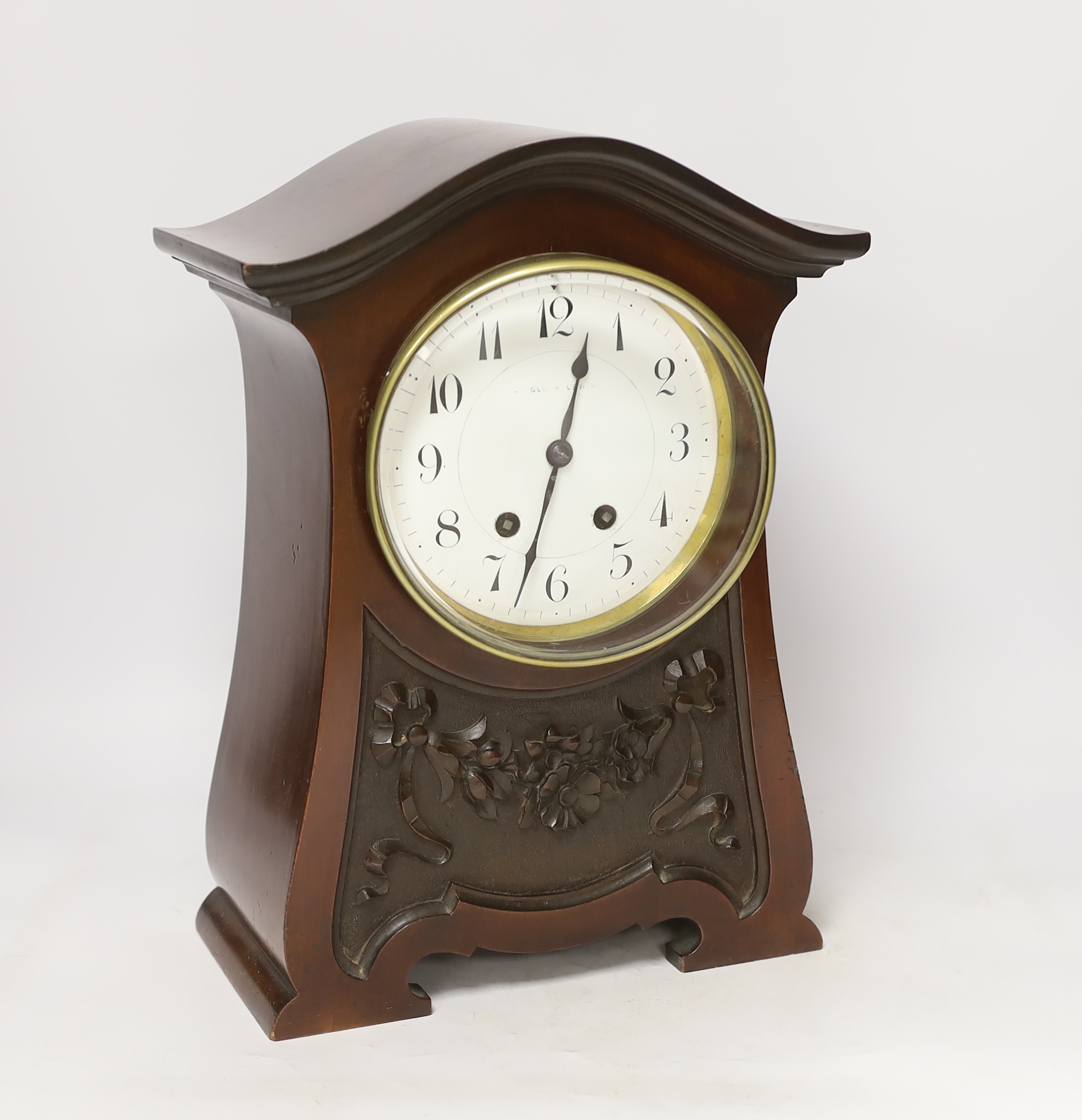 A late Victorian carved mahogany mantel clock, key no pendulum, 35cm
